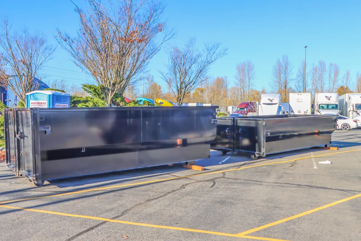 Professional dumpster rental service with roll-off container on residential driveway in Thonotosassa